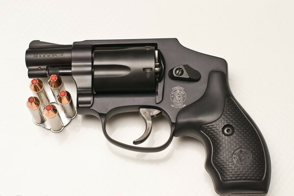 Black revolver with cartridges