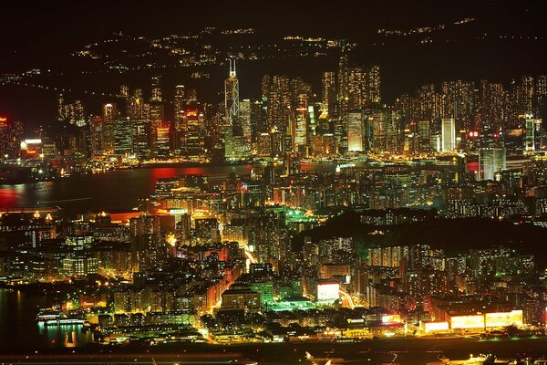 Night metropolis and glowing buildings
