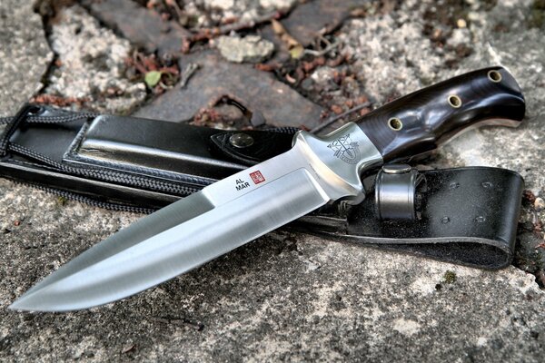 Hunting knife made of steel with a sheath