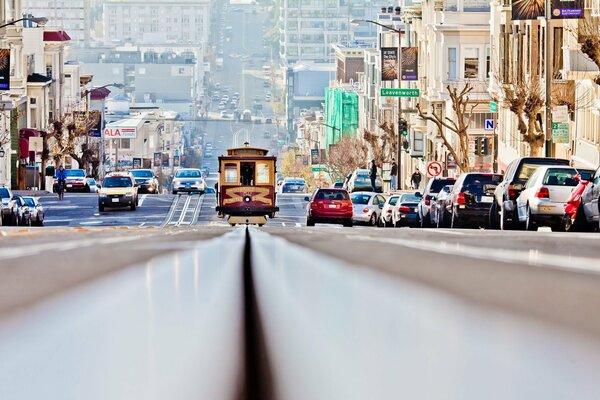 A picture of a tram in San Francisco on the street