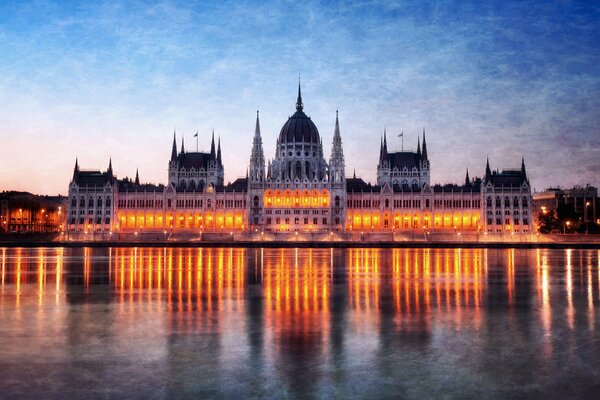 Budapest Parliament at night in the Danube River