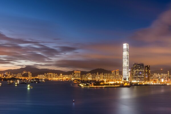 Bay in the night city and clouds