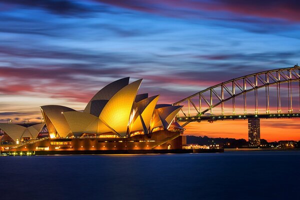 Australia, Opera House in Sydney at sunset illuminated by evening lights