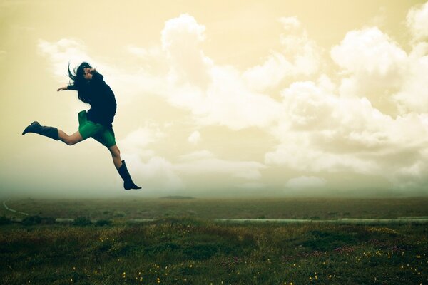 Jump in flight on a beautiful meadow