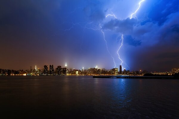 Thunderstorms and lightning at night on the shore