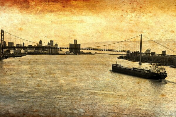 The barge floats under the bridge on the river