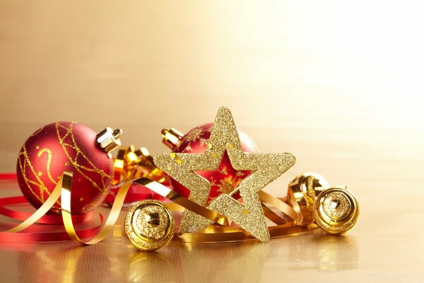 New Year s mood with the image of a golden star , serpentine and toys