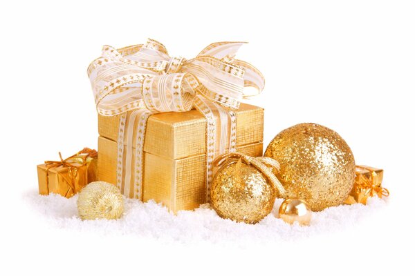 Gift box with balls in gold color