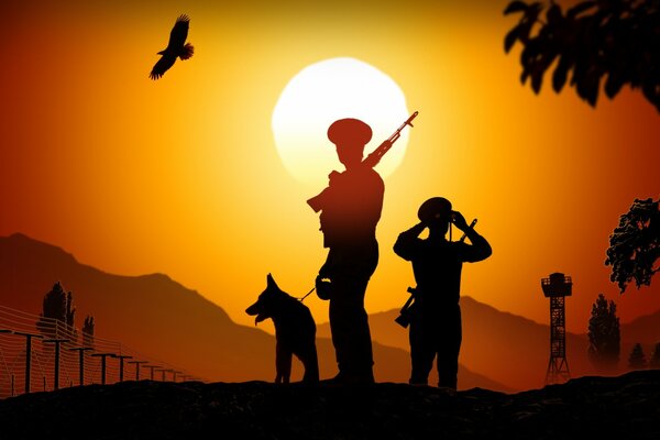 Silhouetten der Grenzgänger bei Sonnenuntergang