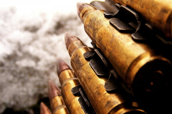 Macro photo of bullets on the background of snow