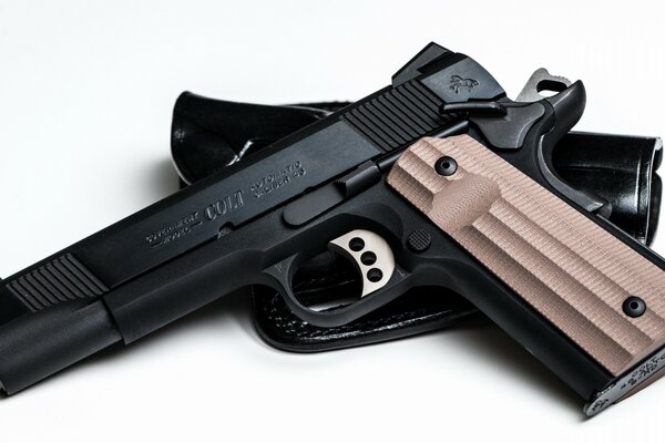 Beautiful pistol and holster on a white background