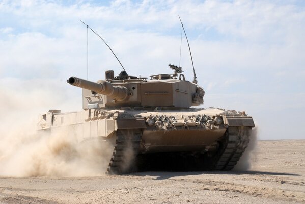Tank in the field in motion