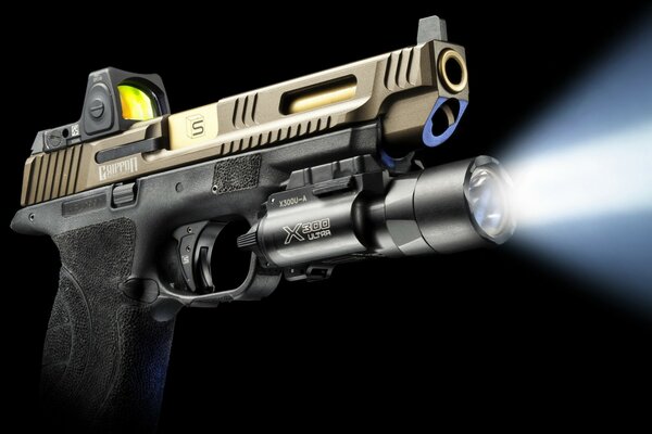 Pistol with a flashlight under the barrel