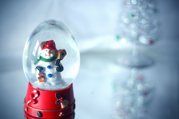 Snowman in a Christmas balloon on a gray background