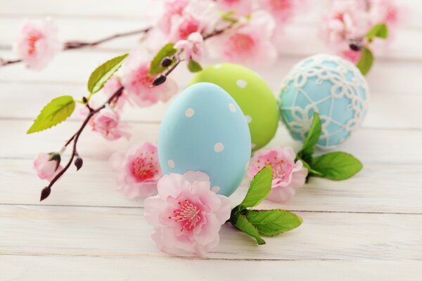 Easter eggs, a branch with flowers