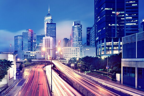 Evening Hong Kong with lights in buildings and reflection