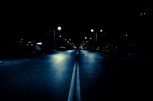 City night road illuminated by lanterns