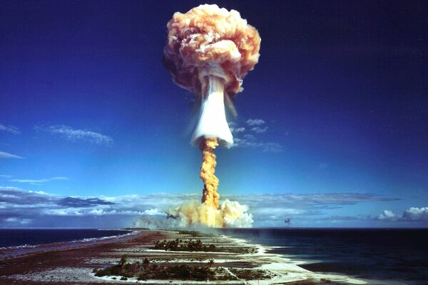 An atomic bomb explodes in the blue sky