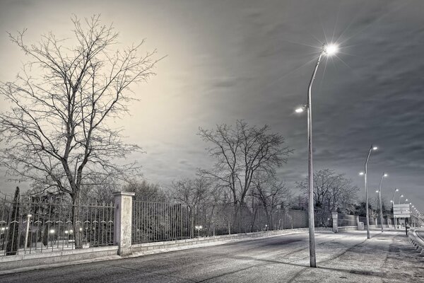 A street with burning lanterns down the road