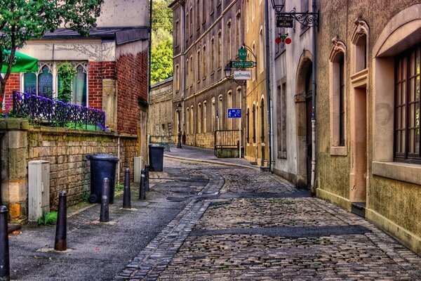 A stone road between houses