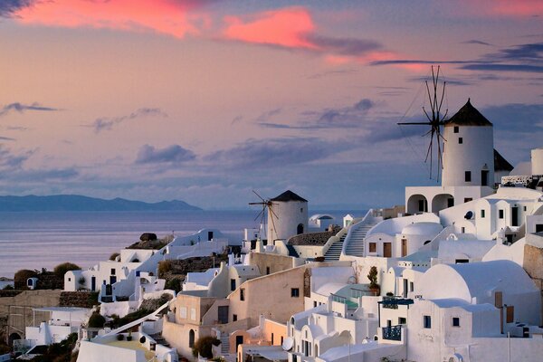 White houses in Greece on the background of sunset