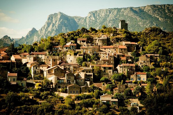 Small houses with red roofs on a hill in France