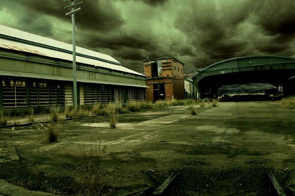 Building and garages on the background of clouds