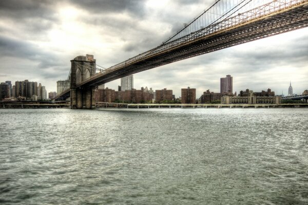 Gray Brooklyn Bridge over the river