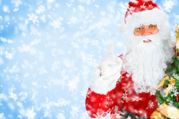 Santa Claus with a Christmas tree on a snowy background