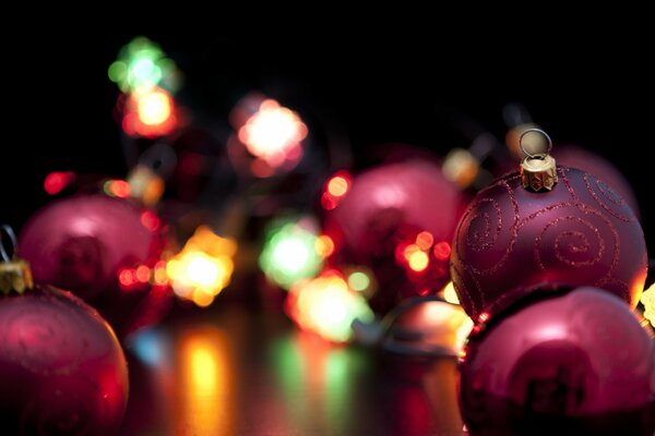 Christmas balls on the background of lights garlands