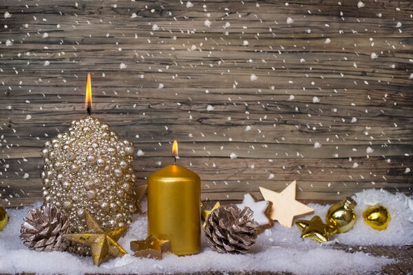 Golden candles and Christmas decorations