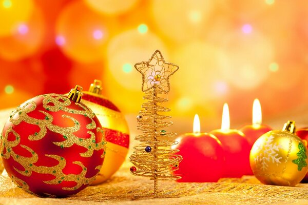 A small golden Christmas tree among Christmas toys