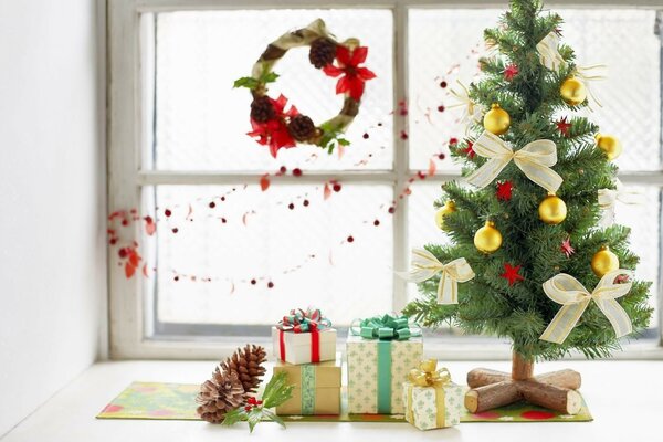 Beautiful Christmas tree with gifts and New Year gifts