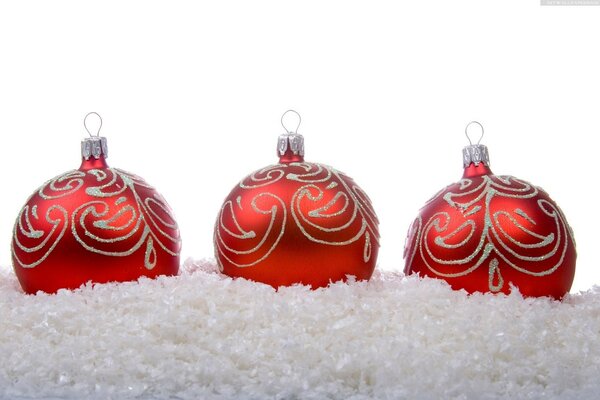 Red Christmas balls in the snow