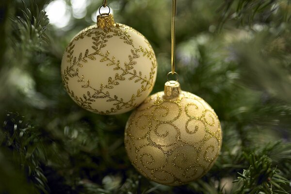 Golden Christmas balls on the Christmas tree. New Year td