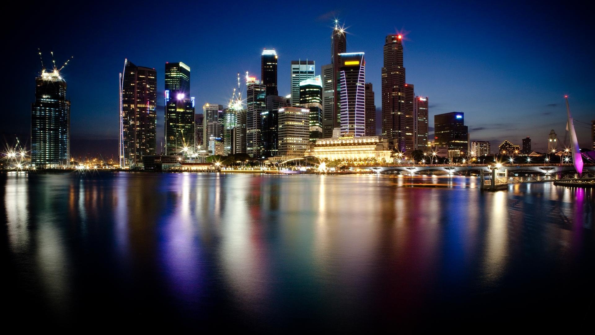 singapur nacht stadt metropole wolkenkratzer lichter wasser reflexion foto hintergrundbilder