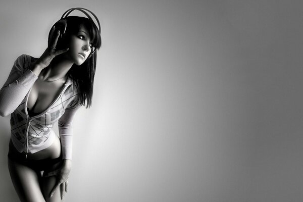 A girl in headphones with a languid look