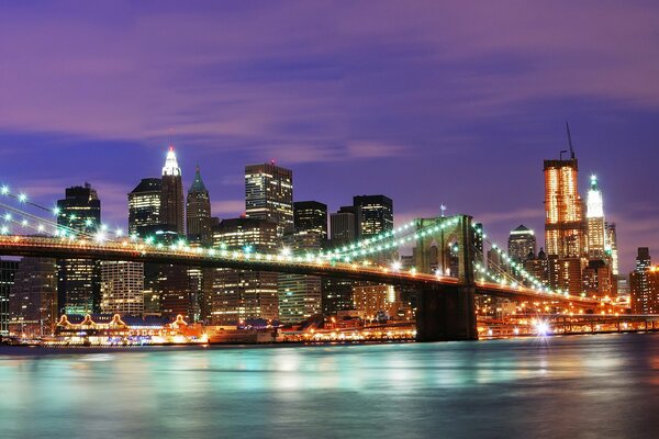 New York, a bridge in lights across the ocean