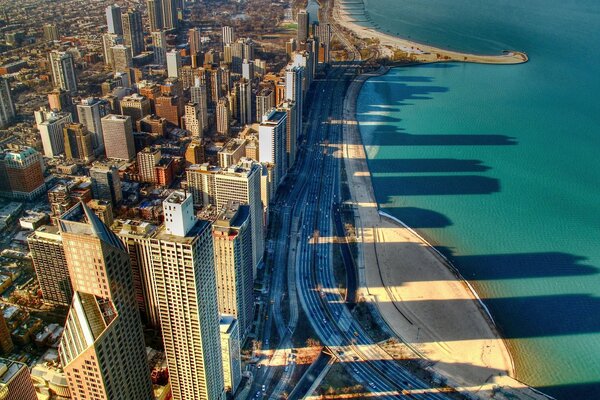 Shadows of the city of Chicago on the beach