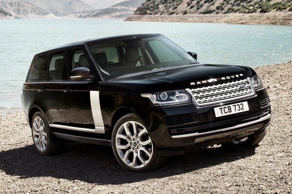 Beautiful black car on the shore