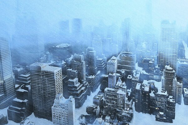 A snow-covered city with high-rise buildings