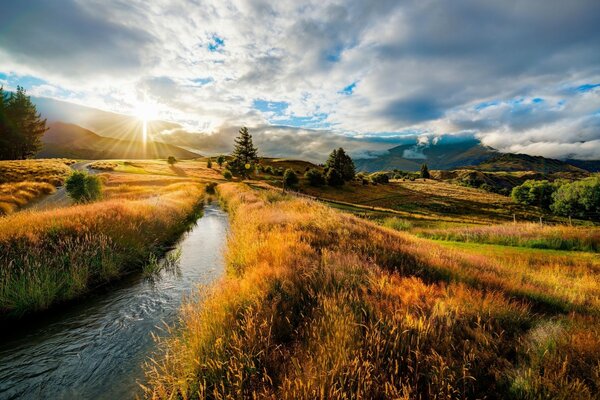 Landscape of autumn hill and mesmerizing clouds