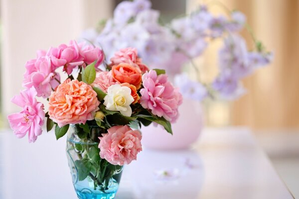 Bouquets of flowers in vases on the table