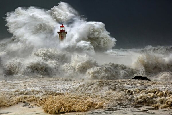 Lighthouse shrouded by a natural storm in the ocean