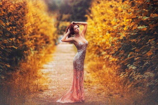 A beautiful girl in an autumn photo shoot