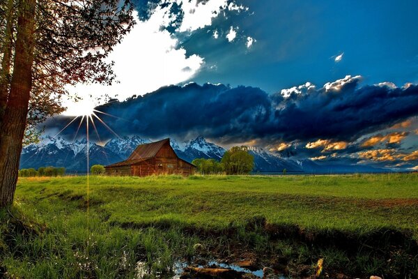 Cloud cover over the house near the mountains