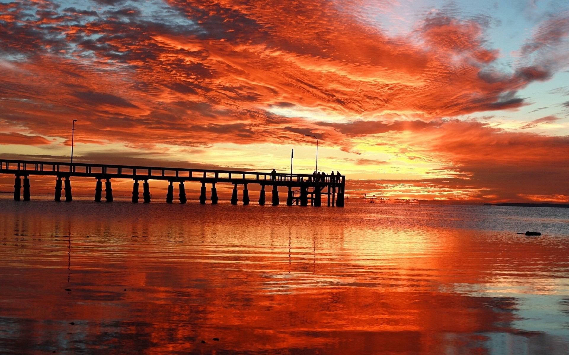 unset pier sky night clouds sea orange bridge textures people