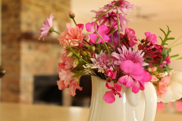 Bouquet of favorite flowers chrysanthemums and gerberas in a jug