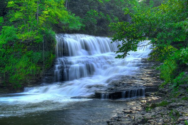 Beautiful waterfall on a background of greenery