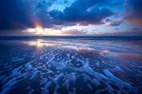 Wave sea and beach at sunset